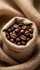 Roasted Coffee Beans in Burlap Sack on Rustic Fabric.