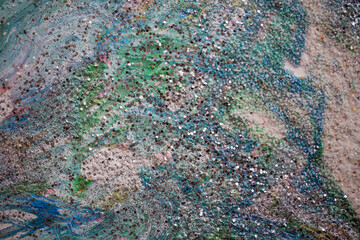 A vibrant abstract painting created by hand using traditional paint techniques, showcasing rich...