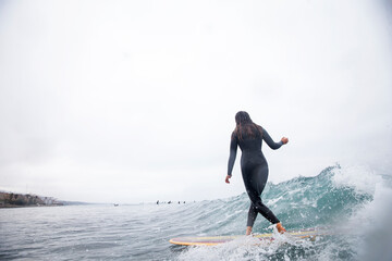 Girl surfing waves