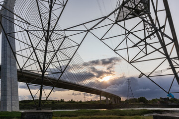 Dramatic sunrise view of Flintshire Bridge in North Wales, captured through the angular framework...