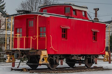 Fully Restored Red Caboose on a Snowy Day in Pennsylvania