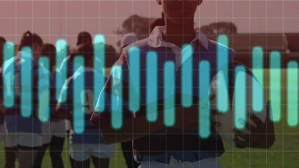 Teenage female rugby player catching rugby ball with overlay pulsating for sports analytics