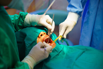 Dentist at work or Concentrated specialist removing tooth stone from client's teeth using ultrasonic scaler. Professional painless teeth cleaning at modern dental
