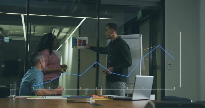 Upon showing color coded chart business team annotating and reviewing data with climbing line graph