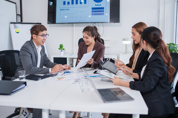 Group of Asian businessmen in suits attending a business investment meeting.