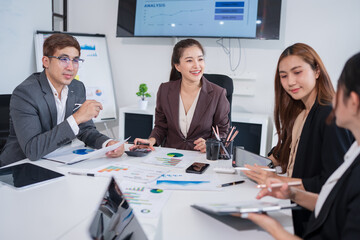 Team of Asian doctors and businesspeople are meeting in a hospital conference room.

