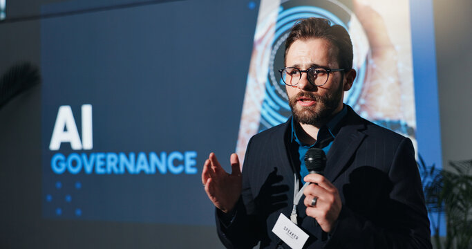 Businessman, microphone and talking at ai conference for governance, ethics and rules. Speech, keynote speaker and person at convention for compliance, policy guidelines and accountability at summit