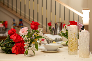 roses and candles on a wedding table. a bright setting.