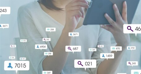 Seated woman tapping tablet screen and updating floating social media stats for marketing analytics - Powered by Adobe
