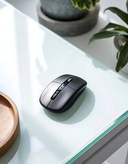 wireless computer mouse on glass table
