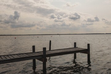 Fototapeta premium long wooden walkway with a view of Lake Steinhude