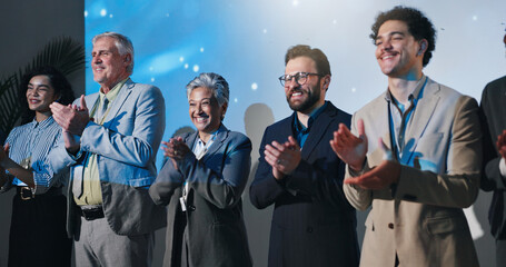 Conference, business people and group applause for celebration, success and thank you. Smile, seminar panel and clapping for achievement, excellence and well done for public speaking at convention