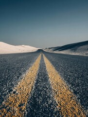 A straight road in the middle of magnificent sand dunes, dramatic photo, simple line drawing, symmetrical composition, at dusk, master of landscape photography, film emulsion fading effect