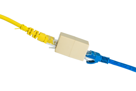 A close up of a yellow and blue ethernet cable connected by a beige colored connector adapter device