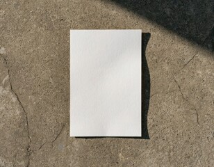Fototapeta premium White Paper on Concrete – Minimal Texture Contrast Flat Lay