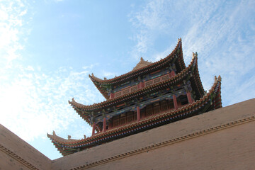 Fototapeta premium Three storey tower is Guanghua Lou (Gate of Elightenment) with flying eaves, Jiayuguan in Gansu Province of China