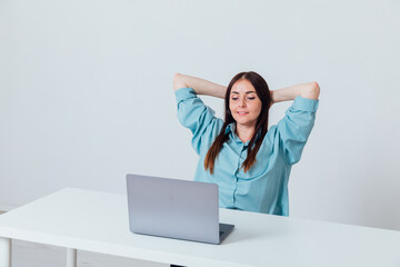 Business woman working on laptop at office desk online