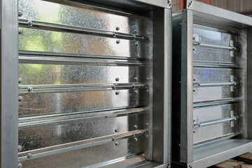 Close-up shot of flaps of fire damper.	
