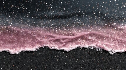 Serene ocean wave with purple hues breaking on dark sand beach, a breathtaking coastal scene.