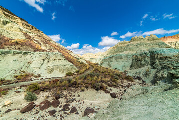 Obraz premium Rainbow Colored Mountains And Sunny Skies