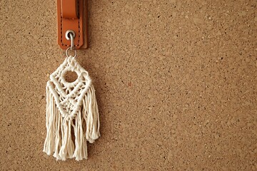 a handcrafted macrame keychain