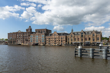 This grand waterside view captures the historic "Batavia" warehouse in Wormer, Netherlands, showcasing its stately architecture and reflecting the industrial heritage of the area . Wormer, Netherlands