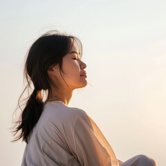 Captivating Sunset Portrait of a Young Woman Embracing Nature's Beauty and Serenity with Gentle Breeze in the Background