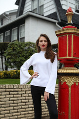 Young woman with red lipstick next to a fire hydrant in New York