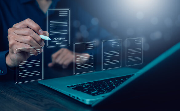 A business professional signing a digital document using an electronic signature on a futuristic interface.paperless contracts, e-signature technology, secure agreements, and digital transformation.
