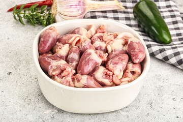 Fresh raw chicken hearts in the bowl