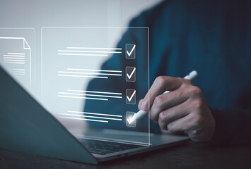 Businessman checklist concept as clipboard document checklist form on the virtual screen Use your...