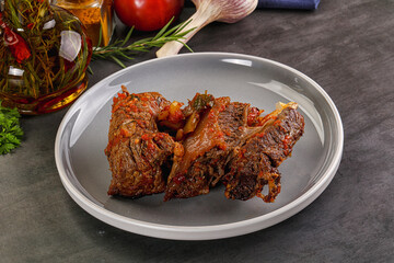 Baked beef ribs with vegetables