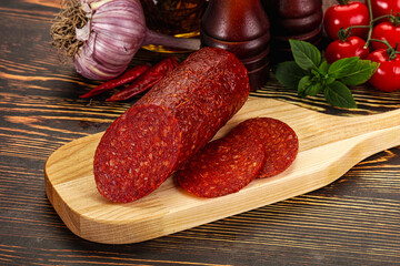 Spicy pepperoni sausages with sliced piece
