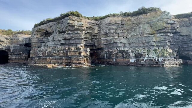 Majestic Sea Cliffs Rising from Ocean in Tasmania, Australia