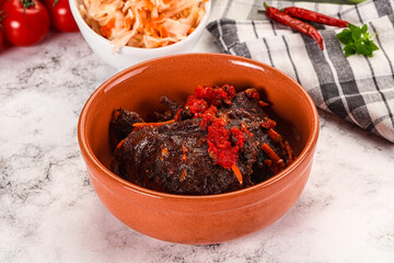 Baked beef cheeks with vegetables