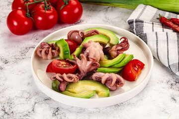 Salad with baby octopus and avocado