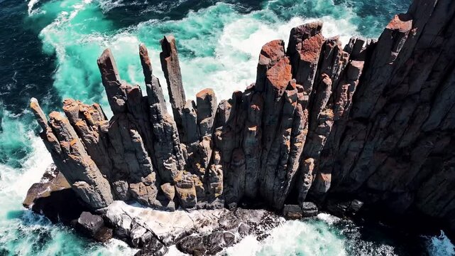 Aerial View of Basalt Column Cliffs and Crashing Waves in Tasmania, Australia