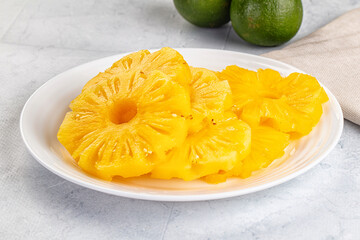 Sweet canned pineapple slices in syrope