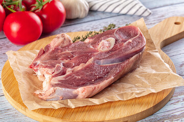 Raw lamb steak with bone