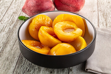 Sweet ripe yellow canned peaches