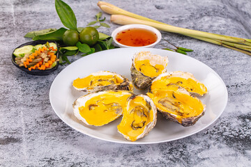 Baked oyster with cheddar cheese