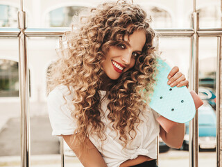 Young beautiful sexy smiling hipster woman with afro curls hairstyle.Trendy model in summer...