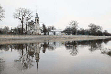 Church on the banks of the northern river in the autumn landscape, view of Orthodox Russia in Vologda