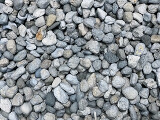 background of stones, Close-up of natural pumice stones in soft blue tones, ideal for background texture, 