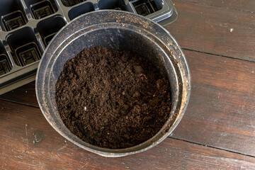Plastic containers for molde seedlings plants, transplanting plants, plastic pots with soil,