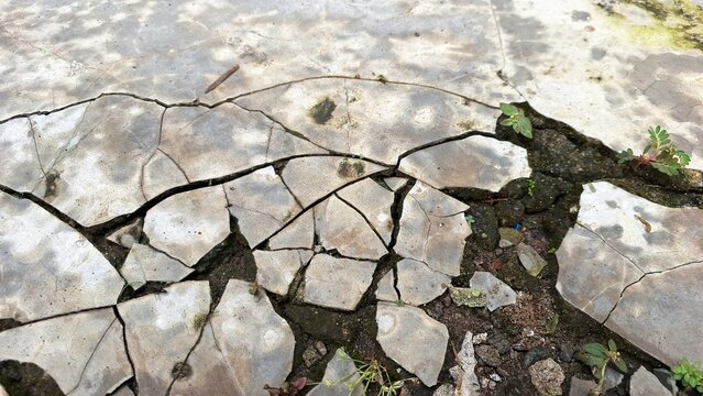 Grunge concrete texture with distressed weathered stone surface, aged wall background with rough cement patterns and abstract industrial texture design element