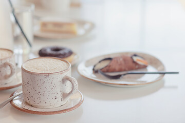 a cup of coffee in the interior of a cozy cafe for breakfast