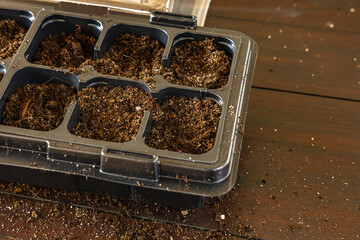 Plastic containers for molde seedlings plants, transplanting plants, plastic pots with soil,