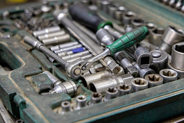 Fototapeta premium Closeup photo shoot of different nesessary tools and parts in every man's garage.Auto check up and car service shop concept.Different type of tools, especially wrenches.