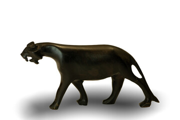 A traditional African hand-carved wooden jaguar souvenir, with a shadow, isolated against a white background